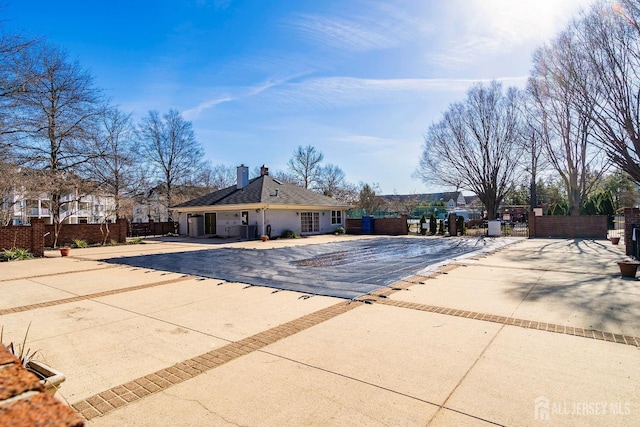 18 Albury Way N, Brunswick, NJ 08902 - view of swimming pool featuring fence and central air condition unit