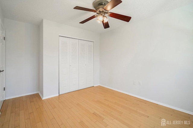 18 Albury Way N, Brunswick, NJ 08902 - unfurnished bedroom with baseboards, a closet, light wood-style flooring, and a ceiling fan