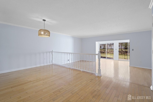 18 Albury Way N, Brunswick, NJ 08902 - empty room featuring crown molding, light wood-type flooring, and baseboards