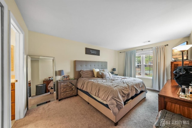 bedroom featuring light colored carpet