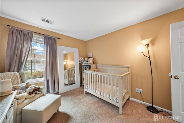 bedroom featuring light colored carpet and a crib