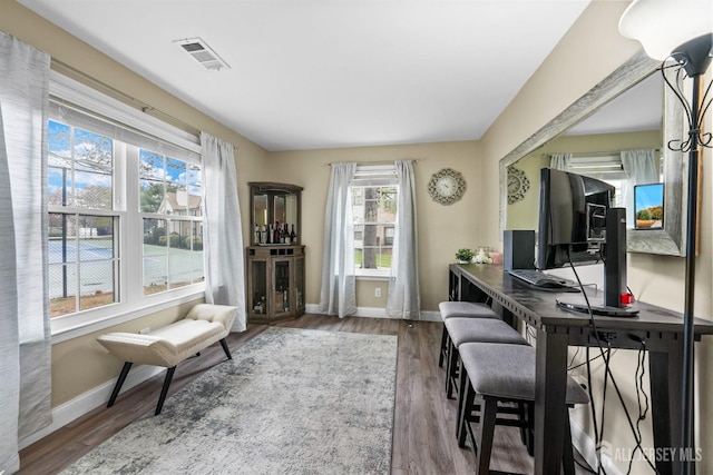 office space with hardwood / wood-style flooring