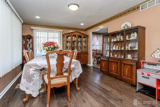 dining room featuring recessed lighting, dark wood-style floors, visible vents, baseboards, and a textured ceiling