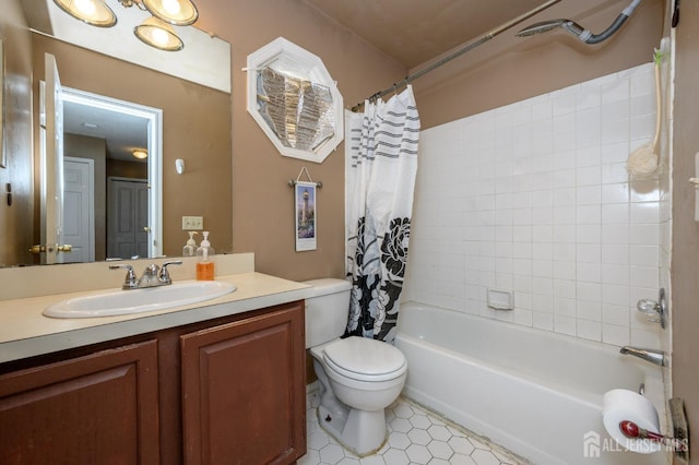 full bath featuring shower / bath combo, vanity, tile patterned flooring, and toilet