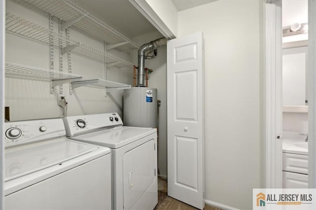 1601 Pebble Pl Unit 1601, Sayreville, NJ 08859 - laundry room featuring laundry area, water heater, baseboards, wood finished floors, and washer and clothes dryer