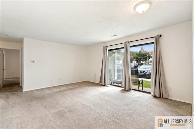 1601 Pebble Pl Unit 1601, Sayreville, NJ 08859 - carpeted empty room featuring a textured ceiling, visible vents, and baseboards