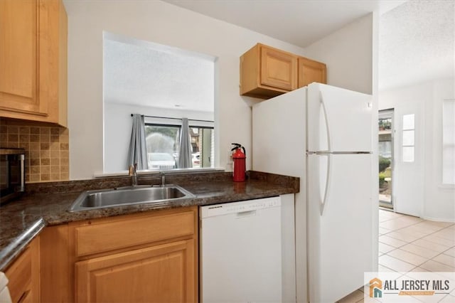 1601 Pebble Pl Unit 1601, Sayreville, NJ 08859 - kitchen with white appliances, decorative backsplash, light tile patterned flooring, and a textured ceiling