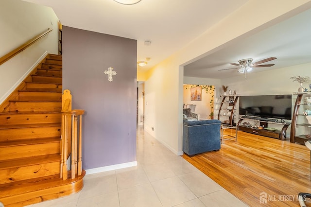 100-A George St, Carteret, NJ 07008 - living area with ceiling fan, tile patterned floors, stairs, and baseboards