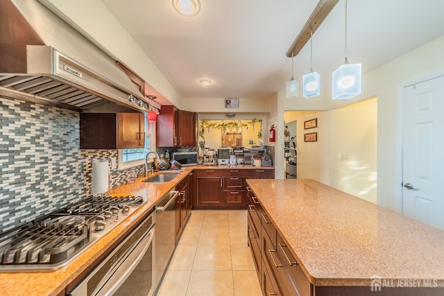100-A George St, Carteret, NJ 07008 - kitchen featuring a sink, under cabinet range hood, decorative backsplash, appliances with stainless steel finishes, and a center island