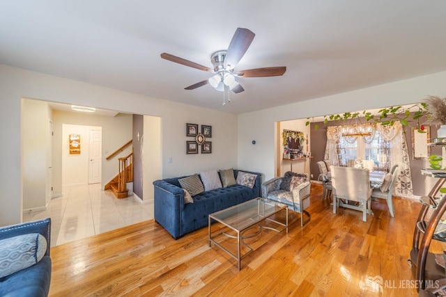 100-A George St, Carteret, NJ 07008 - living room with stairway, ceiling fan, light wood finished floors, and baseboards