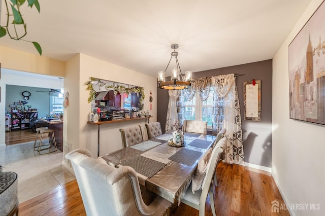 100-A George St, Carteret, NJ 07008 - dining room featuring a chandelier, baseboards, and wood finished floors