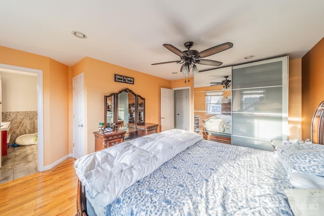 100-A George St, Carteret, NJ 07008 - bedroom with light wood-style floors, a ceiling fan, and baseboards