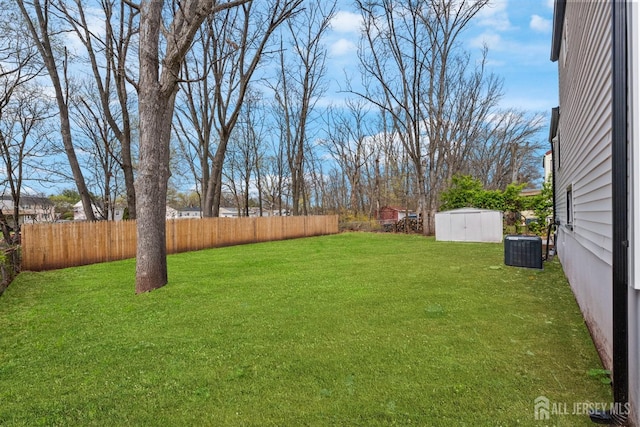 273 Park St, Franklin Twsp, NJ 08873 - view of yard featuring a shed, an outbuilding, and central air condition unit