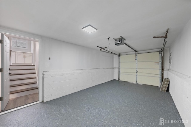 273 Park St, Franklin Twsp, NJ 08873 - garage with a garage door opener and concrete block wall