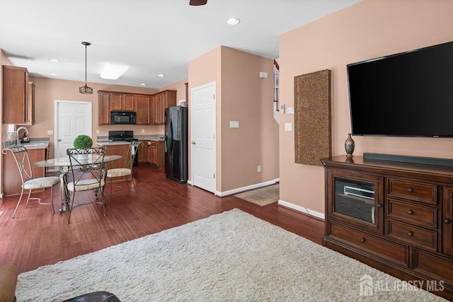 15 Homestead Dr, Burlington Twp, NJ 08068 - kitchen featuring black appliances, dark wood-style flooring, baseboards, light countertops, and brown cabinets