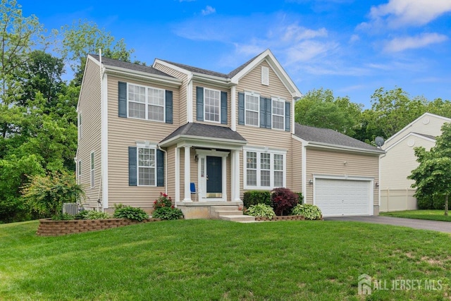 15 Homestead Dr, Burlington Twp, NJ 08068 - view of front of home with asphalt driveway, a garage, and a front yard