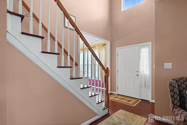15 Homestead Dr, Burlington Twp, NJ 08068 - entrance foyer with wood finished floors, stairway, a high ceiling, and baseboards