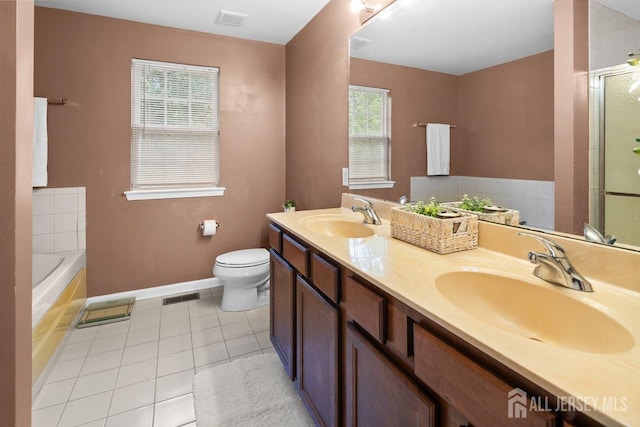 15 Homestead Dr, Burlington Twp, NJ 08068 - bathroom featuring toilet, a garden tub, double vanity, baseboards, and tile patterned flooring