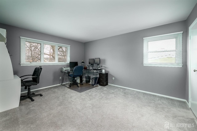 home office with baseboards and carpet floors