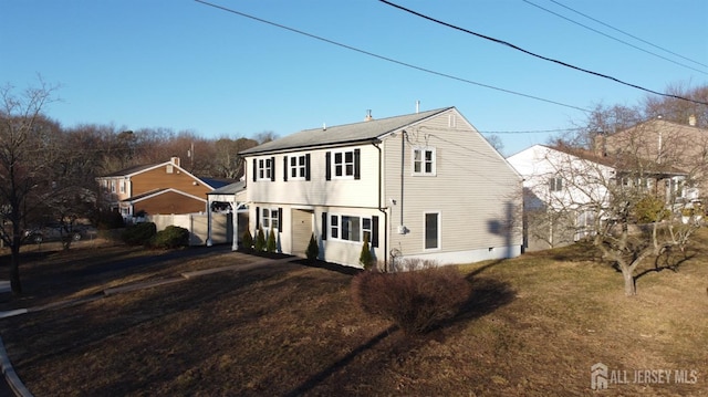 exterior space with a front lawn and fence