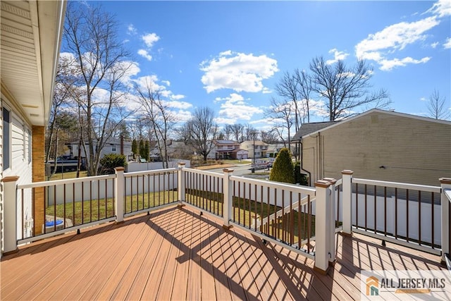 wooden deck featuring a residential view