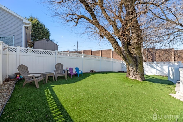 view of yard featuring a fenced backyard