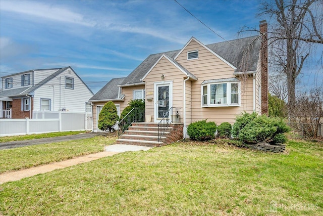 1332 Crescent Ave, Roselle, NJ 07203 - bungalow with a chimney, asphalt driveway, and a garage