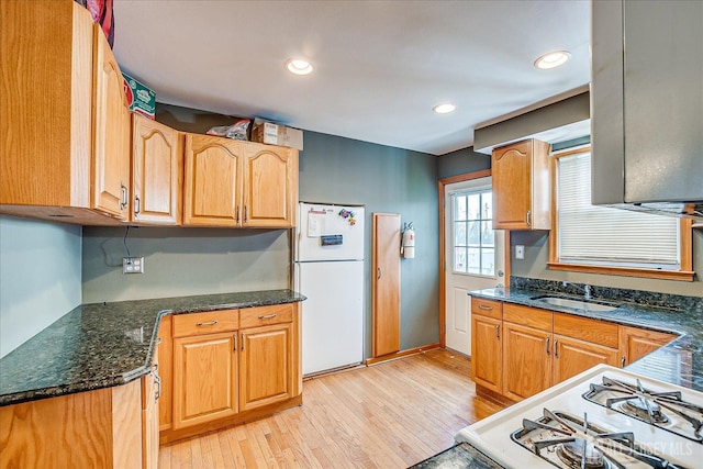 1332 Crescent Ave, Roselle, NJ 07203 - kitchen with white appliances, light wood-style floors, dark stone countertops, a sink, and recessed lighting