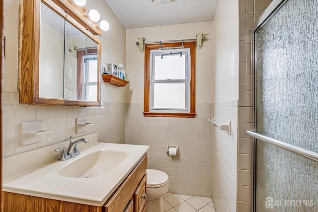 1332 Crescent Ave, Roselle, NJ 07203 - full bath with tile walls, plenty of natural light, tile patterned flooring, a shower stall, and a wainscoted wall