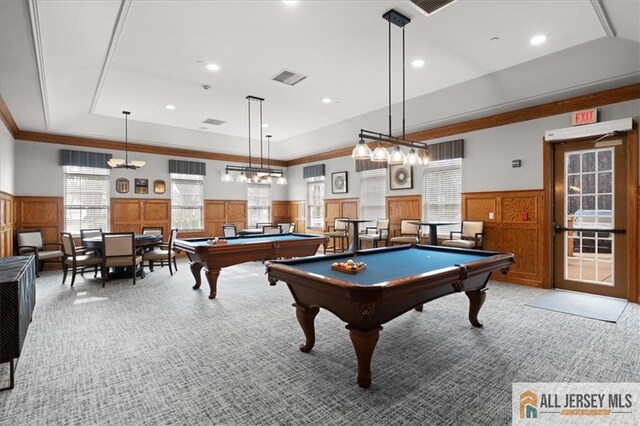 playroom with light colored carpet, ornamental molding, pool table, and a raised ceiling