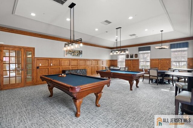 rec room with pool table, a tray ceiling, and carpet floors