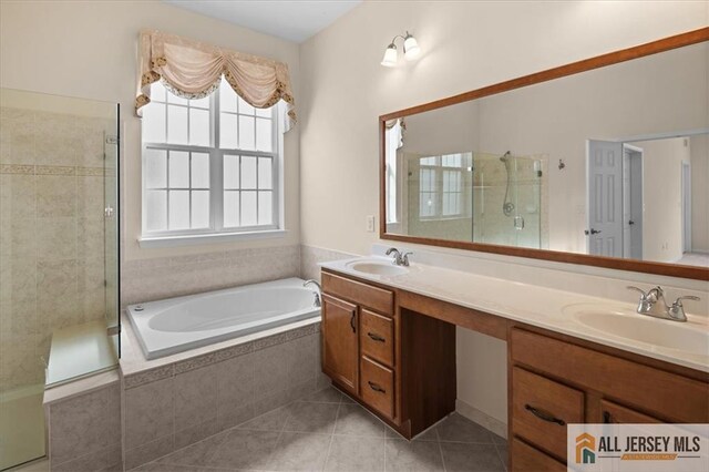 bathroom featuring tile patterned flooring, vanity, and independent shower and bath