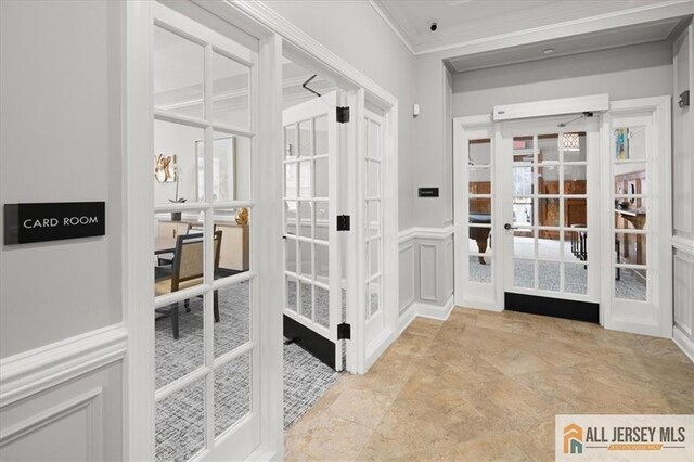 interior space featuring crown molding and french doors