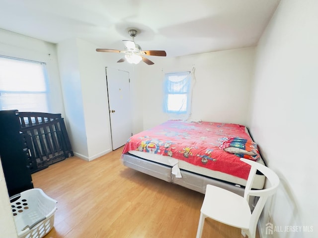 910 Roanoke Ave, Hillside, NJ 07205 - bedroom featuring wood finished floors, ceiling fan, and baseboards