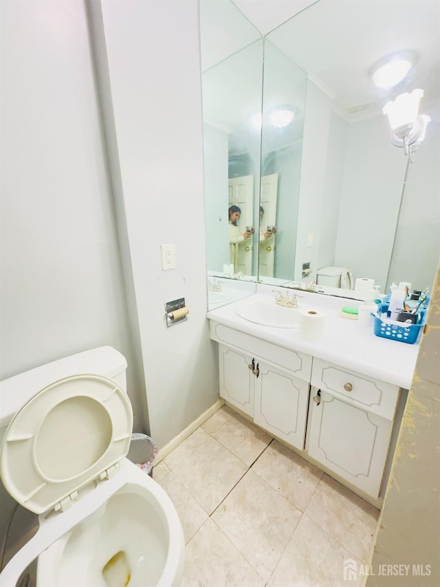 910 Roanoke Ave, Hillside, NJ 07205 - half bath featuring toilet, vanity, tile patterned flooring, and baseboards