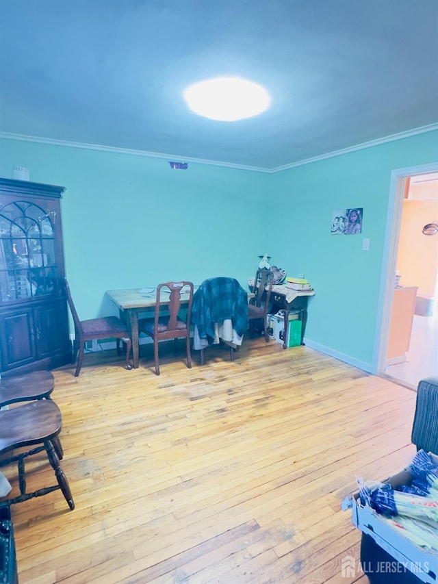910 Roanoke Ave, Hillside, NJ 07205 - game room with crown molding, light wood finished floors, and baseboards