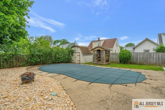 14 Fisher Ave, Middlesex, NJ 08846 - view of pool featuring an outdoor fire pit, a fenced backyard, and a patio