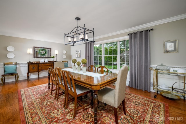 7 Manor Ct, Old Bridge, NJ 08857 - dining space featuring crown molding, a chandelier, and wood finished floors