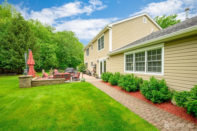 7 Manor Ct, Old Bridge, NJ 08857 - view of grassy yard featuring a patio area