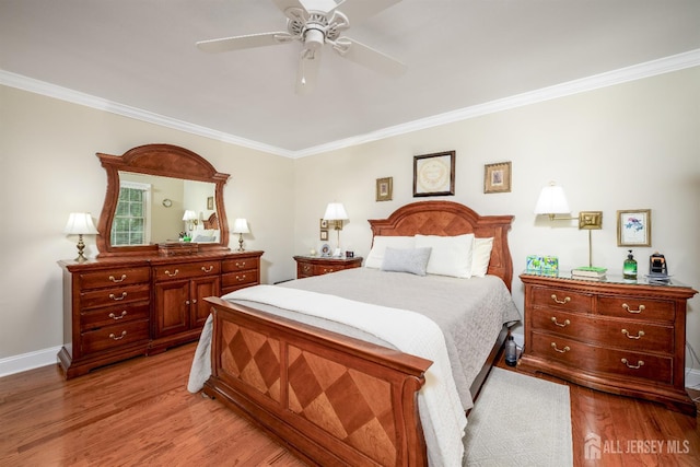 7 Manor Ct, Old Bridge, NJ 08857 - bedroom with crown molding, light wood finished floors, baseboards, and ceiling fan