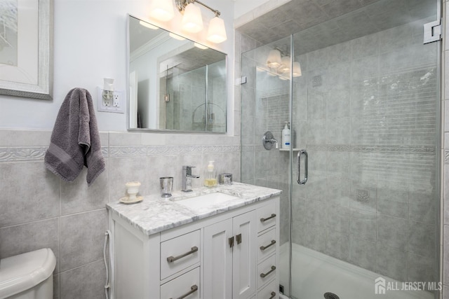 7 Manor Ct, Old Bridge, NJ 08857 - full bathroom featuring tile walls, vanity, a stall shower, and toilet