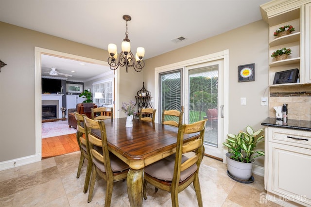 7 Manor Ct, Old Bridge, NJ 08857 - dining room featuring a chandelier and a fireplace