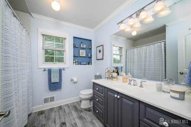 7 Manor Ct, Old Bridge, NJ 08857 - bathroom with crown molding, vanity, toilet, wood finished floors, and baseboards