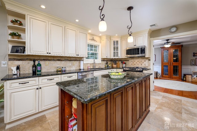 7 Manor Ct, Old Bridge, NJ 08857 - kitchen featuring appliances with stainless steel finishes, open shelves, a sink, backsplash, and cream cabinets