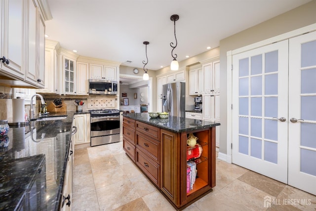 7 Manor Ct, Old Bridge, NJ 08857 - kitchen with stainless steel appliances, a sink, tasteful backsplash, glass insert cabinets, and recessed lighting
