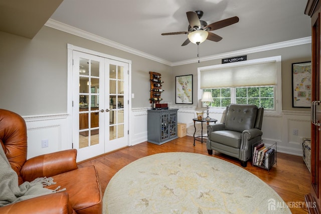 7 Manor Ct, Old Bridge, NJ 08857 - living area featuring french doors, wood finished floors, ornamental molding, ceiling fan, and a wainscoted wall