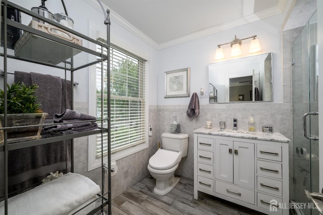 7 Manor Ct, Old Bridge, NJ 08857 - full bath with tile walls, toilet, vanity, crown molding, and healthy amount of natural light