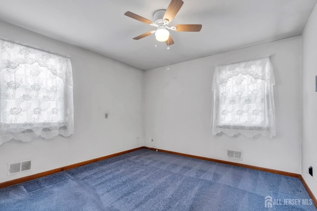 unfurnished room with carpet floors, ceiling fan, and baseboards