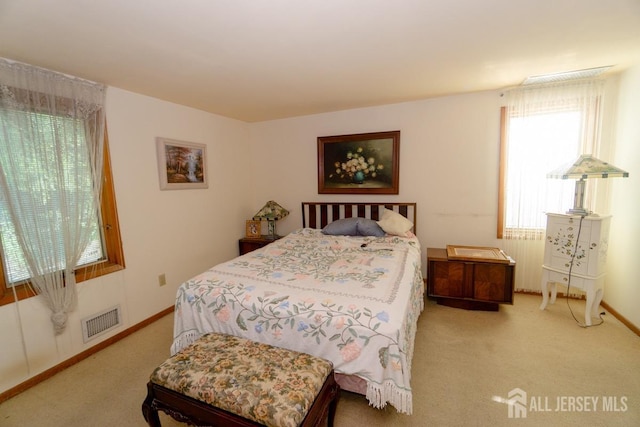 35 Barkalow St, South Amboy, NJ 08879 - carpeted bedroom with multiple windows and baseboards