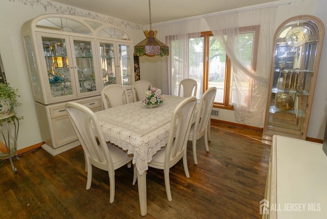 35 Barkalow St, South Amboy, NJ 08879 - dining area featuring dark wood-style flooring and baseboards